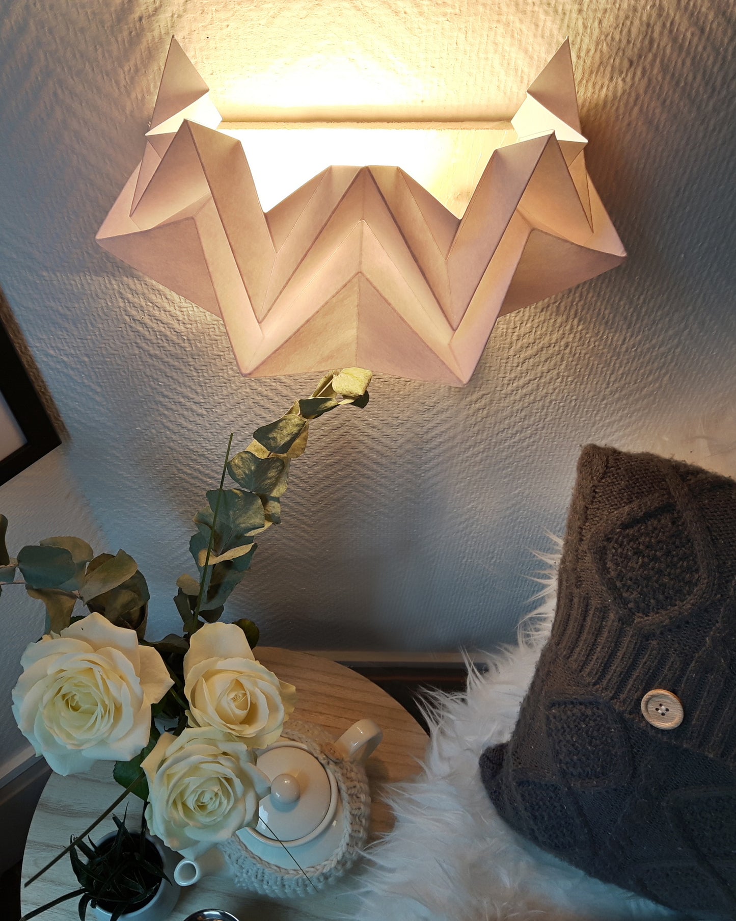 detail white origami sconce night view reading nook lighting Tedzukuri Atelier